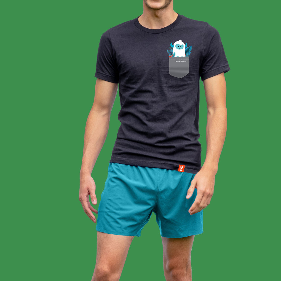 niantic having fun yeti pocket tee black in front of green background